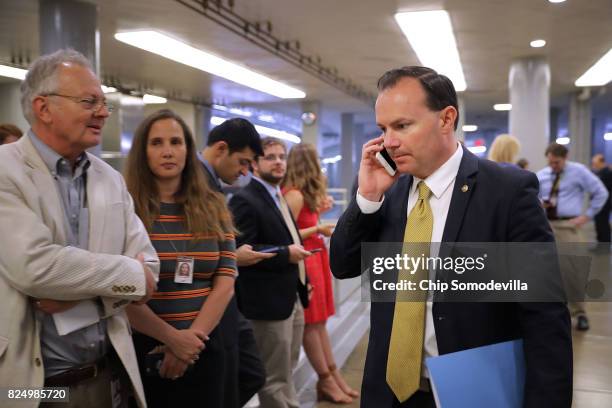 Sen. Mike Lee talks on the phone as he heads to the U.S. Capitol for a vote July 31, 2017 in Washington, DC. Senate GOP leadership was unable to...