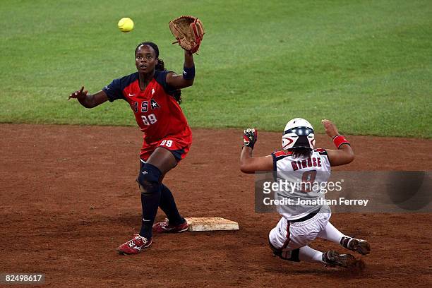 Megu Hirose of Japan slides into second base as shortstop Natasha Watley of the United States waits for the ball during the women's grand final gold...