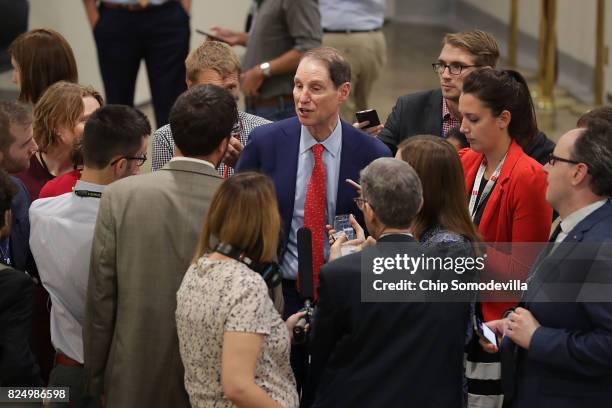 Sen. Ron Wyden talks with reporters as he heads to the U.S. Capitol for a vote July 31, 2017 in Washington, DC. Senate GOP leadership was unable to...