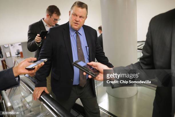 Sen. Jon Tester talks to reporters as he heads to the U.S. Capitol for a vote July 31, 2017 in Washington, DC. Senate GOP leadership was unable to...