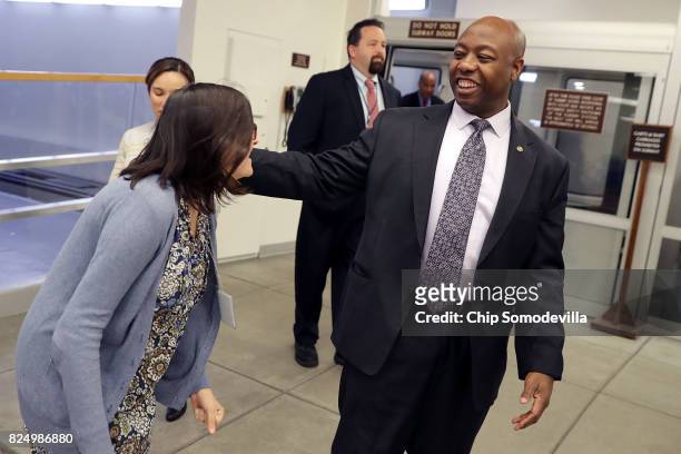 Sen. Tim Scott talks to a reporter as he heads to the U.S. Capitol for a vote July 31, 2017 in Washington, DC. Senate GOP leadership was unable to...