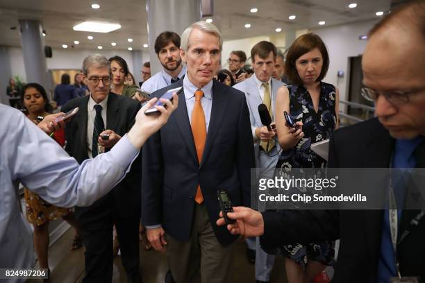 Sen. Rob Portman is pursued by reporters following a vote at the U.S. Capitol July 31, 2017 in Washington, DC. Senate GOP leadership was unable to...