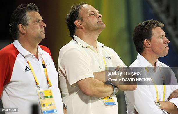 Kurt Gravemeier , Germany's showjumping head coach, team veterinarian Bjoern Nolting and German rider Markus Beerbaum are pictured at the equestrian...