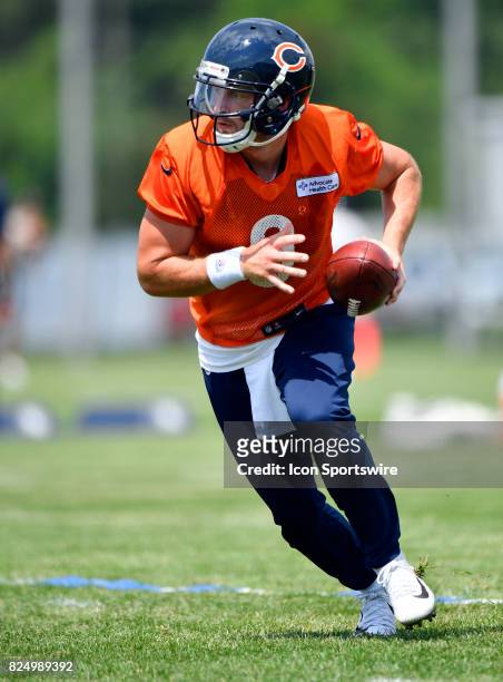 Chicago Bears quarterback Connor Shaw prepares to hand off the ball during the Chicago Bears Training Camp on July 31, 2017 at Olivet Nazarene...