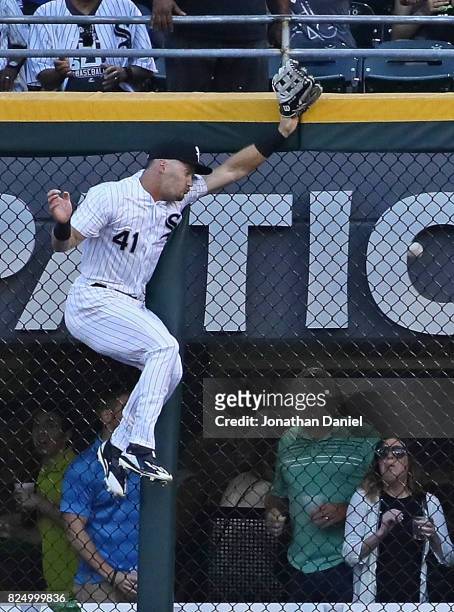 Adam Engel of the Chicago White Sox hits the wall trying to reach a home run ball hit by Josh Donaldson of the Toronto Blue Jays in the 1st inning at...