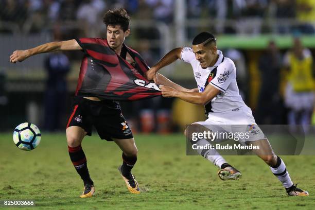 Gilberto of Vasco da Gama struggles for the ball with Matheus Rossetto of Atletico PR during a match between Vasco da Gama and Atletico PR as part of...