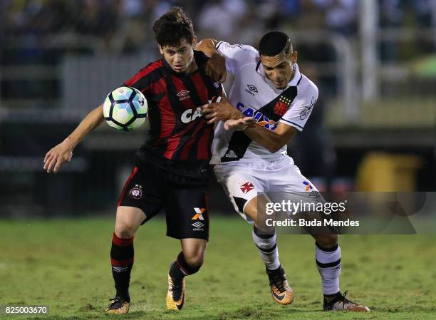 Gilberto of Vasco da Gama struggles for the ball with Matheus Rossetto of Atletico PR during a match between Vasco da Gama and Atletico PR as part of...