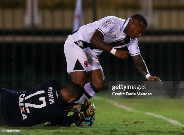 Manga Escobar of Vasco da Gama struggle for the ball with goalkeeper Weverton of Atletico PR during a match between Vasco da Gama and Atletico PR as...