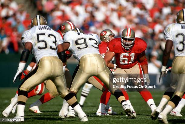 Jesse Sapolu of the San Francisco 49ers in action against the New Orleans Saints during an NFL football game November 15, 1992 at Candlestick Park in...