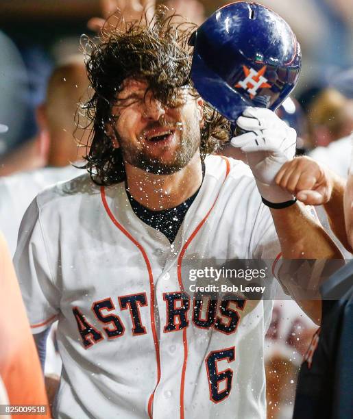 Jake Marisnick of the Houston Astros celebrates in the dugout after htting a three run home run in the third inning against the Tampa Bay Rays at...