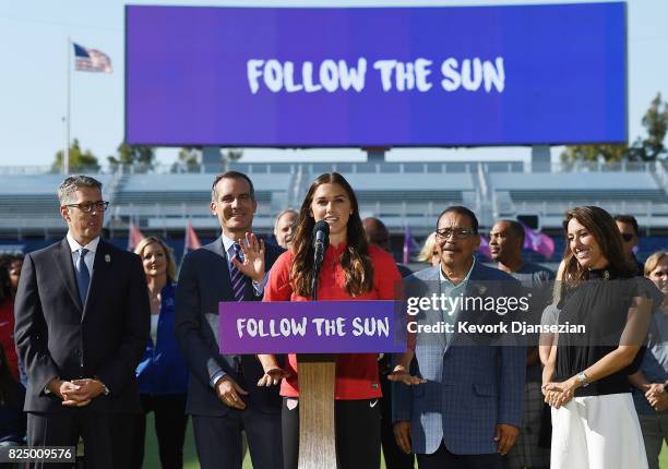 United States Women's soccer team forward Alex Morgan speaks at the podium with LA 2024 Bid Chairman Casey Wasserman , Los Angeles Mayor Eric...