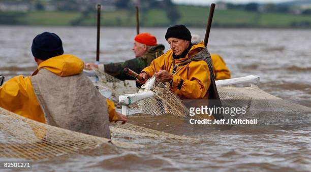 Haaf netters fish on the mudflats of Port Carlisle in the Solway Firth estuary on August 21, 2008 near Wigton in Cumbria, England. The fishing method...