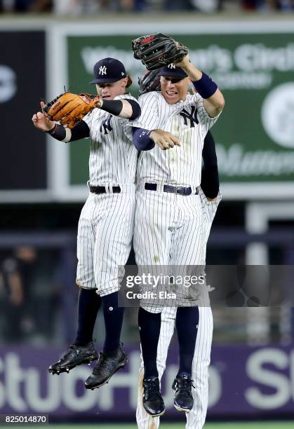 Clint Frazier,Jacoby Ellsbury and Aaron Judge of the New York Yankees celebrate the win over the Detroit Tigers on July 31, 2017 at Yankee Stadium in...