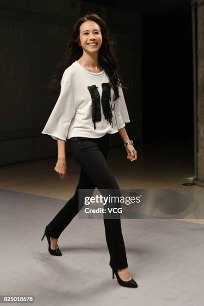 Singer Karen Mok walks the runway at Replay fashion show on July 31, 2017 in Shanghai, China.