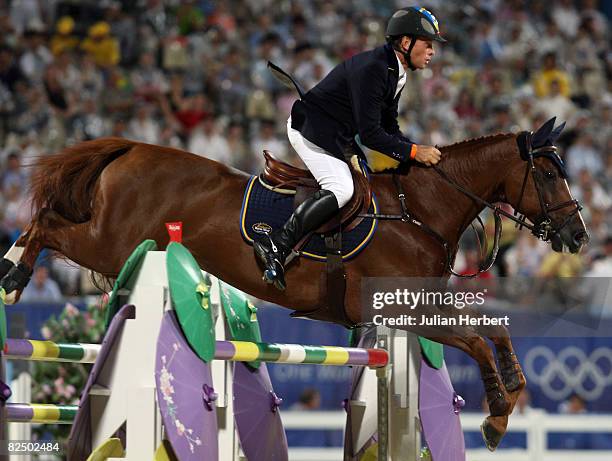 Rolf-Goran Bengtsson of Sweden and Ninja jump a fence during The Individual Jumping Round B held at the Hong Kong Olympic Equestrian Venue in Sha Tin...