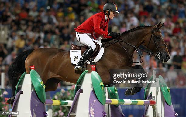 Meredith Michaels-Beerbaum of Germany and Shutterfly jump a fence during the Individual Jumping Final - Round B held at the Hong Kong Olympic...