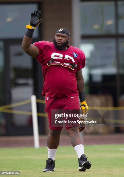 Washington Redskins defensive lineman Phil Taylor, Sr. Walks onto the field prior to practice during day three of Redskins training camp on July 29,...