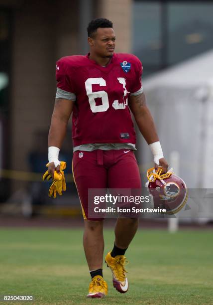 Washington Redskins defensive lineman Brandon Banks walks onto the field prior to practice during day three of Redskins training camp on July 29,...