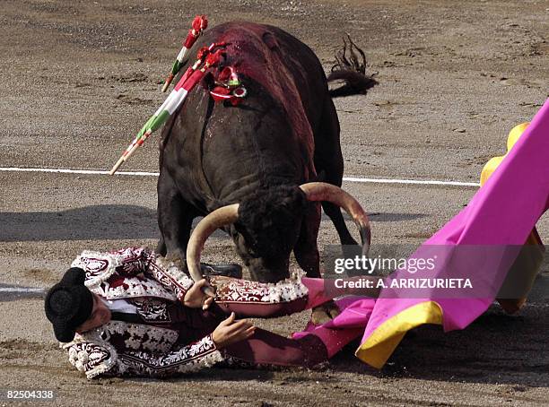 Spanish banderillero Antonio Tejero is gored by a Nunez del Cuvillo fighting bull, during the fifth corrida of the Aste Nagusia festivities, on...