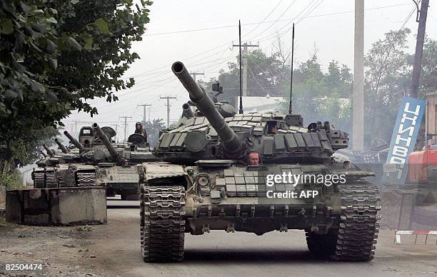 Column of Russian tanks leaves the South Ossetian capital Tskhinvali on August 21 to the border of Russian Federation. Russia's withdrawal of all its...