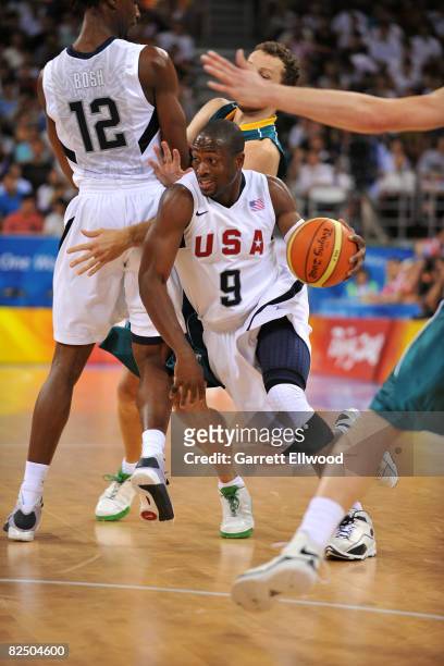 Dwyane Wade of the US Men's Senior National team dribbles against Australia during the men's basketball quarterfinal game during Day 12 of the...