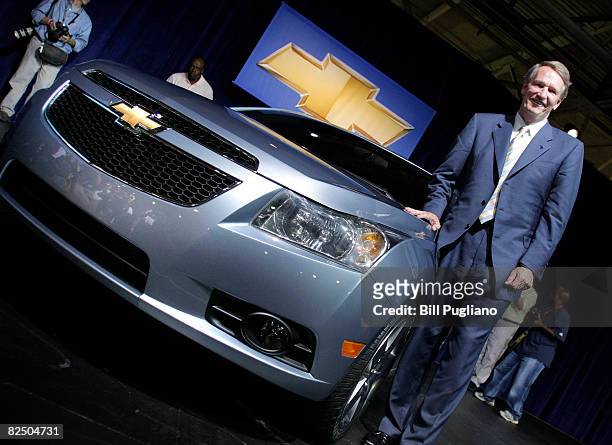 Rick Wagoner, Chairman and Chief Executive Officer of General Motors Corporation, stands next to a foam model of the Chevy Cruze, GM's all-new global...