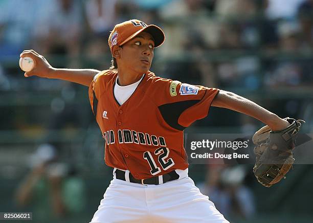 Starting pitcher Kevin Morales of Latin America throws a pitch against Mexico during the international semi-final at Lamade Stadium on August 21,...