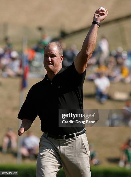 Former big league pitcher Jim Abbott throws out the ceremonial first pitch before Latin America takes on Mexico during the international semi-final...