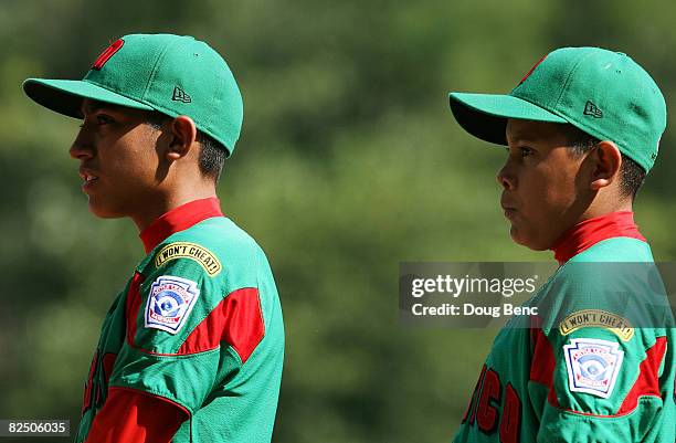 Shortstop Tomas Castillo and centerfielder Ruben Molina of Mexico listen to introductions prior to taking on Latin America during the international...