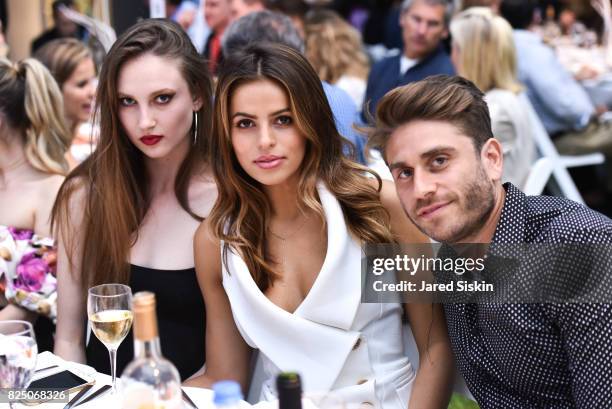 Claudia Todman, Brooks Nader and Eric Marx attend The 24th Annual Watermill Center Summer Benefit & Auction at The Watermill Center on July 29, 2017...