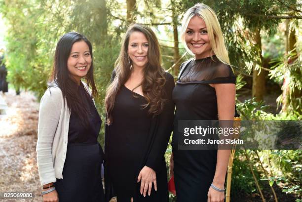 Wen Wen, Brooke Millstein and Maria Filomava attend The 24th Annual Watermill Center Summer Benefit & Auction at The Watermill Center on July 29,...