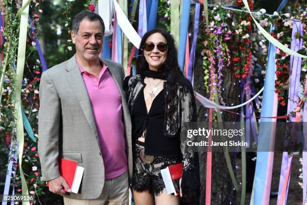 Phillip Kassova and Steph Paynes attend The 24th Annual Watermill Center Summer Benefit & Auction at The Watermill Center on July 29, 2017 in Water...