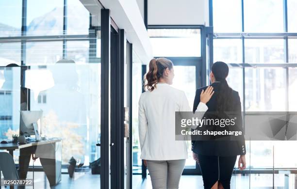 she's a warm and welcoming coworker - care stock pictures, royalty-free photos & images
