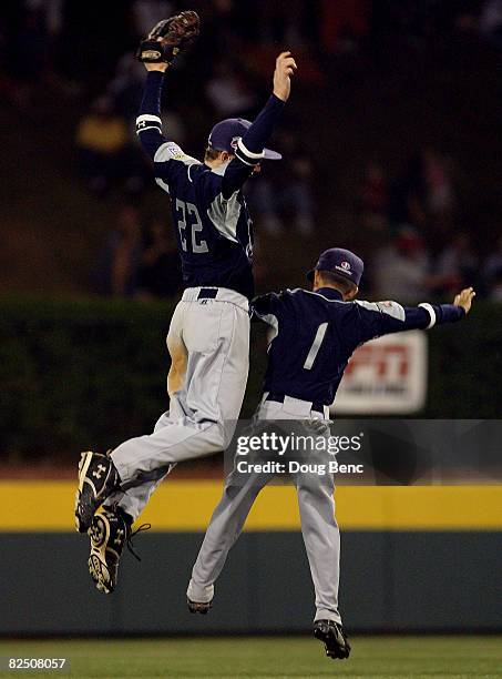 Centerfielder Trey Quinn and second baseman Hunter Self of Southwest celebrate victory over the Southeast during the United States semi-final at...