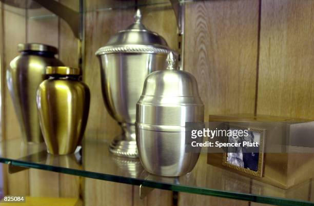 Urns for cremation ashes and other memorials are sold February 24, 2001 at the Hartsdale Canine Cemetery in Westchester, New York. The cemetery, with...