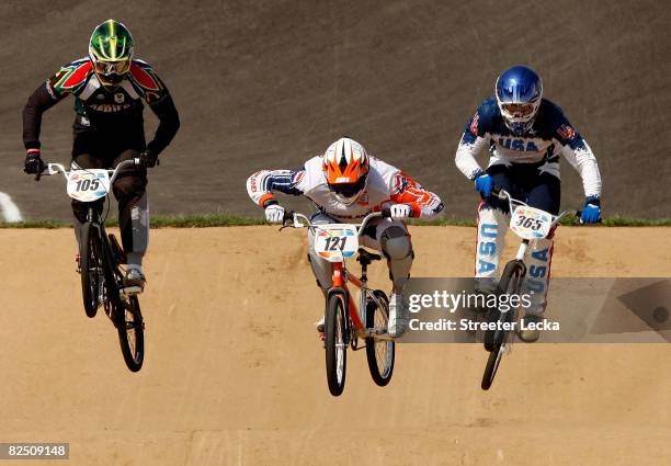 Sifiso Nhlapo of South Africa, Raymon van der Biezen of the Netherlands and Mike Day of the United States compete in the Men's BMX semifinal run held...