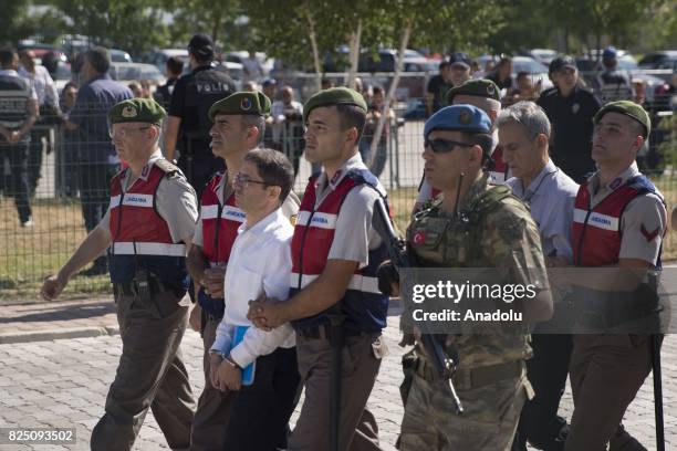 Defendants Kemal Batmaz and Akin Ozturk and other defendants arrive for their trial accompanied with gendarmerie commandos of Sincan Penal...