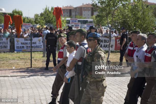 Defendants Kemal Batmaz and Akin Ozturk and other defendants arrive for their trial accompanied with gendarmerie commandos of Sincan Penal...