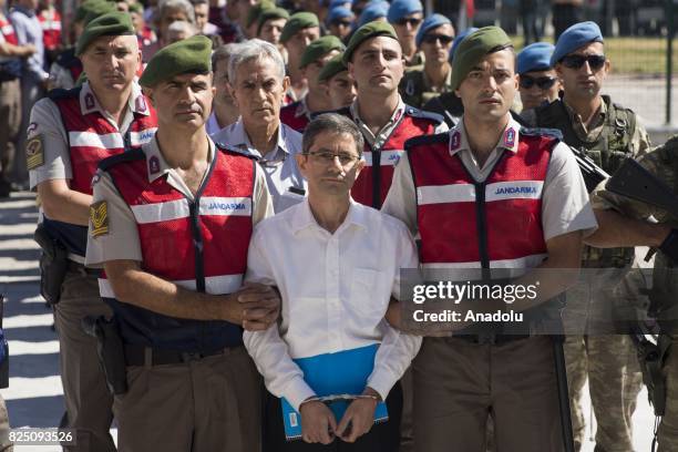 Defendants Kemal Batmaz and Akin Ozturk and other defendants arrive for their trial accompanied with gendarmerie commandos of Sincan Penal...