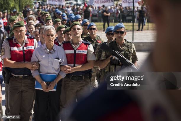 Defendant Akin Ozturk and other defendants arrive for their trial accompanied with gendarmerie commandos of Sincan Penal Institution at Ankara 4th...