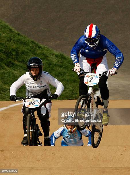 Sarah Walker of New Zealand, Gabriela Diaz of Argentina and Anne-Caroline Chausson of France race in the women's BMX semifinal held at the Laoshan...