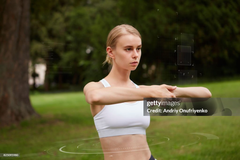 Young woman doing sport exercises outside