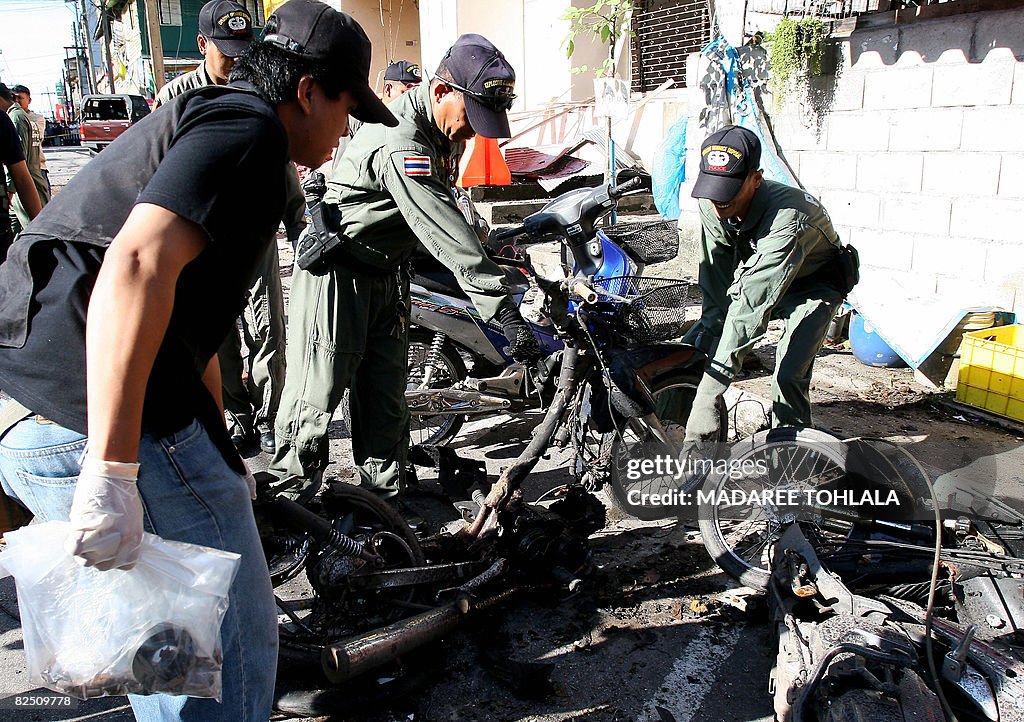 Thai bomb squad units inspect a blast-da