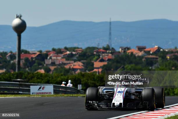 Paul di Resta of Great Britain driving the Williams Martini Racing Williams FW40 Mercedes on track during the Formula One Grand Prix of Hungary at...