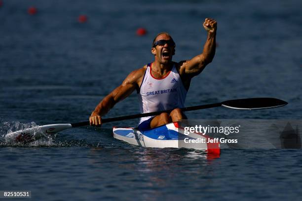 Tim Brabants of Great Britain celebrates winning the gold medal in the men's flatwater kayak single 1000m Men Final at the Shunyi Olympic...