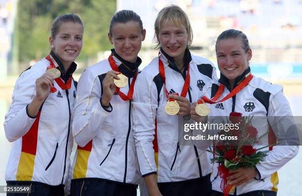 Team Germany celebrates after winning the gold medal in the Kayak Four 500m Women Final event at the Shunyi Olympic Rowing-Canoeing Park on Day 14 of...