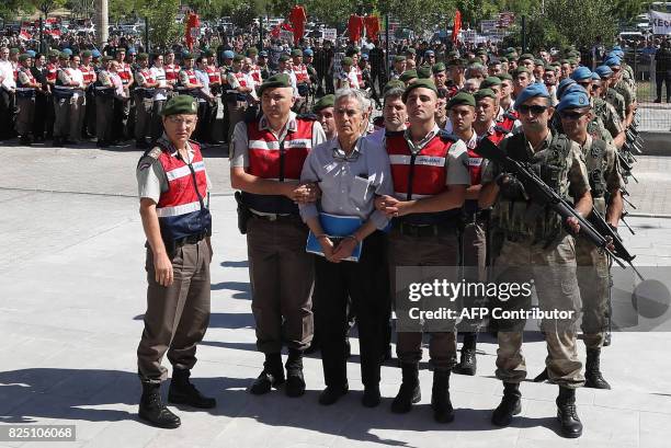 Defendant Akin Ozturk and other defendants are accompanied by gendarmerie as they arrive for their trial at Sincan Penal Institution at the 4th Heavy...