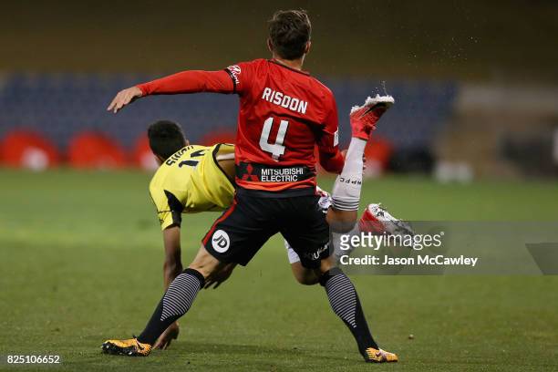 Josh Risdon of the Wanderers and Sarpreet Singh of the Phoenix compete for the ball during the FFA Cup round of 32 match between the Western Sydney...