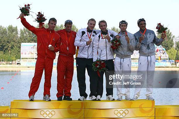 Silver medalists Kim Wraae Knudsen and Rene Holten Poulsen of Denmark, gold medalists Martin Hollstein and Andreas Ihle of Germany and bronze...