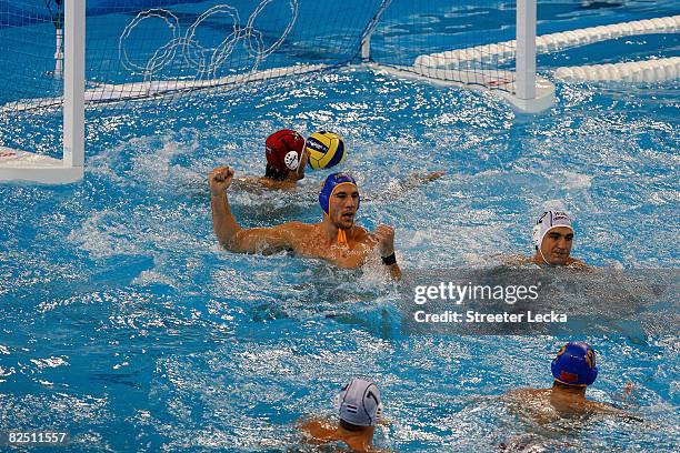 Aleksandar Ivovic of Montenegro reacts after he scored a goal against Hungary during a semifinal game of the water polo event at the Ying Tung...